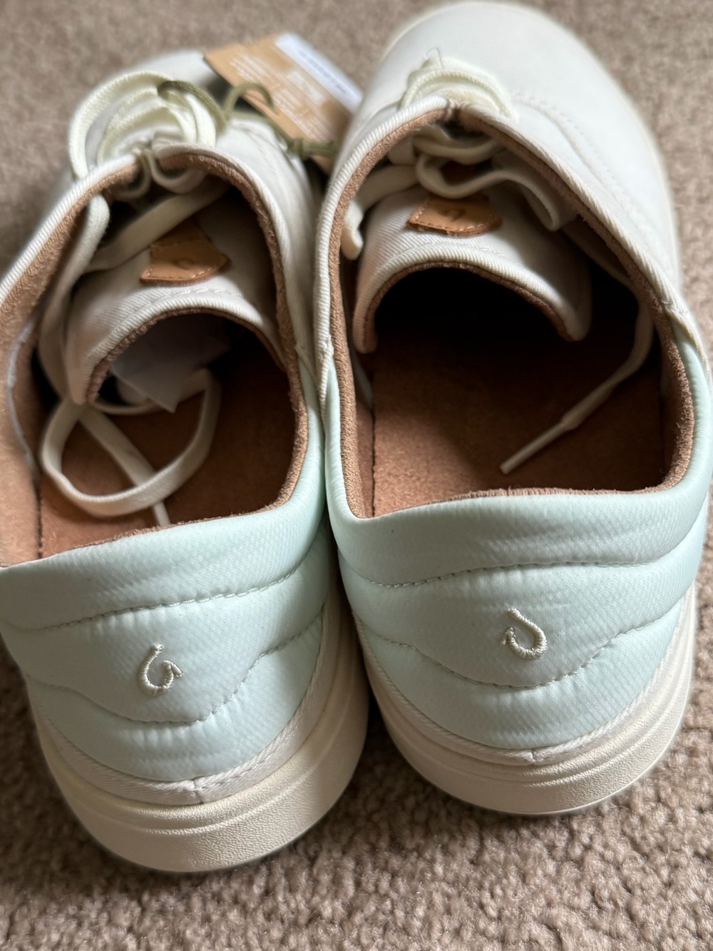 OluKai Kohu Low-Top Sneaker in Cream with light foam green on heel - Picture 4 of 5